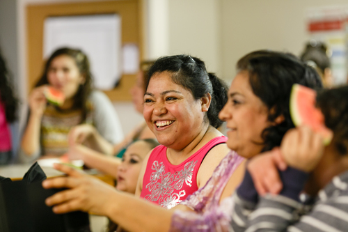 Image of a group of smiling Hispanic women.