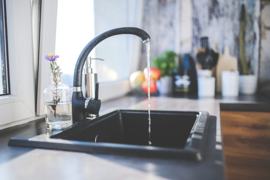 Image of water running from a faucet.