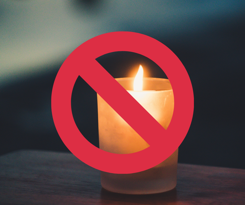 Image of a candle with a "No" symbol in front of it.