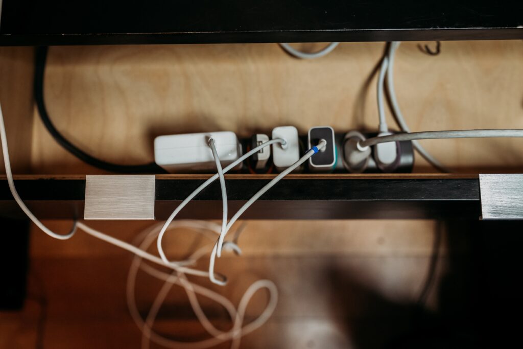 Image of a power strip completely filled with plugs and cords.