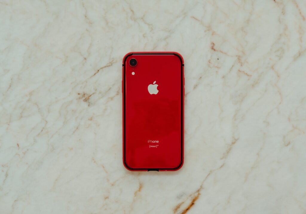 Image of an iPhone in a red case.
